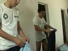 Prison guard examines the asses of young convicts