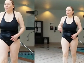 Sexy grandma is sexy at 66 in a black swimsuit