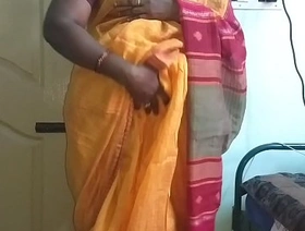 Desi indian horny tamil telugu kannada malayalam hindi cheating wife vanitha wearing orange colour saree showing big boobs and shaved pussy press hard boobs press nip rubbing pussy masturbation