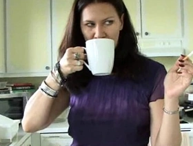 Sexy milf makes herself some coffee while smoking