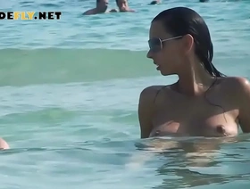 Hot nudist babe sunbathes on nude beach